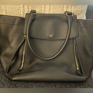 Tory Burch black leather handbag. Gold color hardware. Convertible tote.
